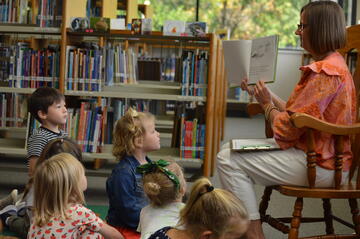 Xavier Elementary teacher reading to students in classroom