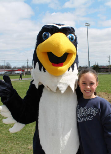 Xavier Hawk Mascot with Middle School Student